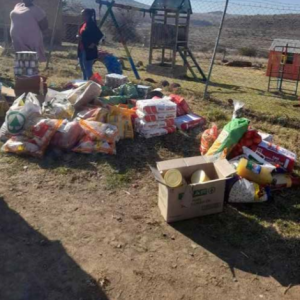 DPWI entourage accompanied by the Chief of Staff remember Tsomo’s informal settlement and hand out the soccer kits.